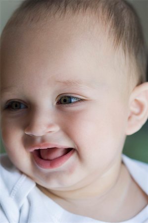 Close-up of a baby boy smiling Stock Photo - Premium Royalty-Free, Code: 630-01709557