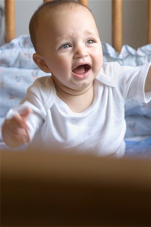 Baby boy crying in a crib Stock Photo - Premium Royalty-Free, Code: 630-01709577