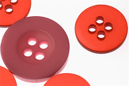 sewing top view - Close-up of red and pink buttons Stock Photo - Premium Royalty-Free, Code: 630-01709639