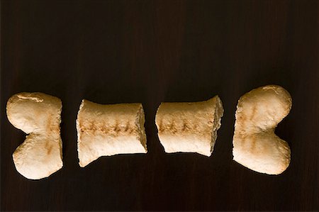 dog bone - High angle view of a dog biscuit Stock Photo - Premium Royalty-Free, Code: 630-01709703