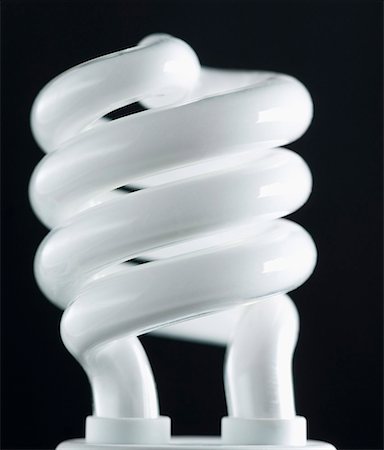 Close-up of a lit compact fluorescent light bulb Stock Photo - Premium Royalty-Free, Code: 630-01709855