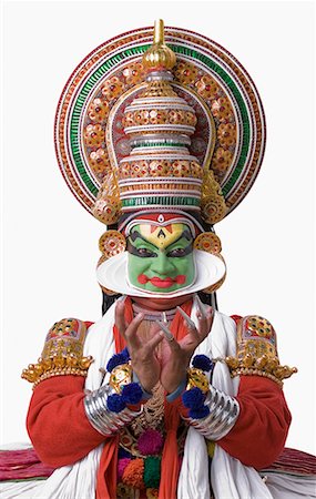 face at camera - Portrait of a Kathakali dance performer dancing Stock Photo - Premium Royalty-Free, Code: 630-01709936