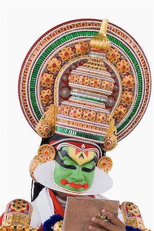 simsearch:857-03553638,k - Close-up of a Kathakali dance performer holding a mirror Stock Photo - Premium Royalty-Free, Code: 630-01709932