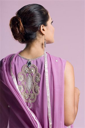 Rear view of a mid adult woman standing in salwar kameez Stock Photo - Premium Royalty-Free, Code: 630-01709998