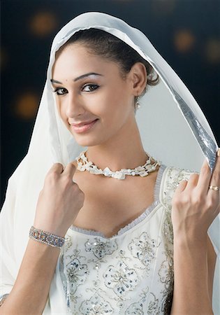 Portrait of a young woman in lehenga choli Stock Photo - Premium Royalty-Free, Code: 630-01710041