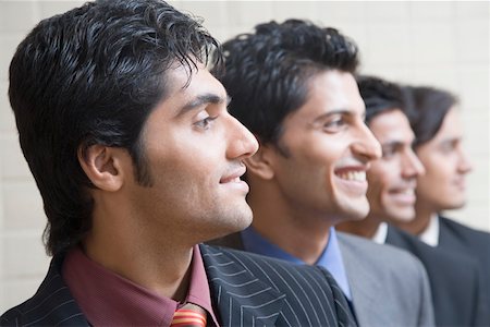 reclutar - Close-up of four businessmen smiling Foto de stock - Sin royalties Premium, Código: 630-01874126