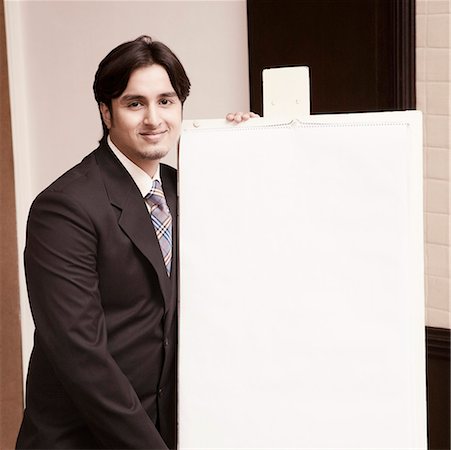 simsearch:630-01873857,k - Portrait of a businessman giving presentation near a whiteboard Foto de stock - Royalty Free Premium, Número: 630-01874149