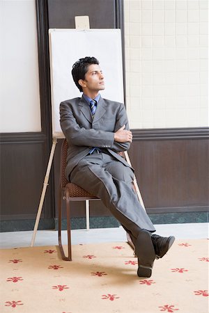 sole of shoe - Businessman sitting on a chair and thinking Stock Photo - Premium Royalty-Free, Code: 630-01874159