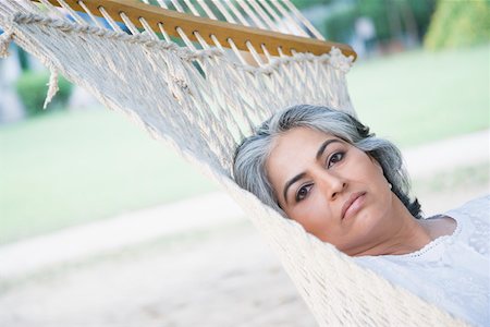 simsearch:630-01874237,k - Portrait of a mature woman lying in a hammock Stock Photo - Premium Royalty-Free, Code: 630-01874233