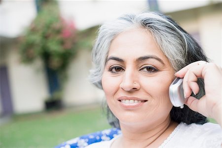 simsearch:630-01874237,k - Portrait of a mature woman talking on a mobile phone Stock Photo - Premium Royalty-Free, Code: 630-01874258