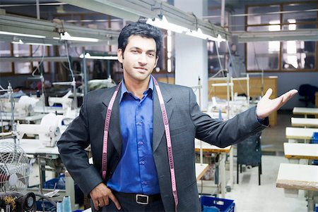 sewing machine factory - Portrait of a male fashion designer standing in a textile industry Stock Photo - Premium Royalty-Free, Code: 630-01874306