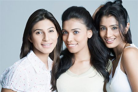 friends black background - Portrait of three young women smiling Stock Photo - Premium Royalty-Free, Code: 630-01874409