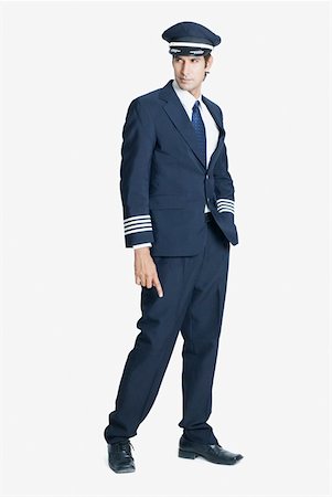 Pilot standing with his hand in his pocket Stock Photo - Premium Royalty-Free, Code: 630-01874445