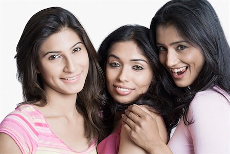 friends black background - Portrait of three young women smiling Stock Photo - Premium Royalty-Free, Code: 630-01874442