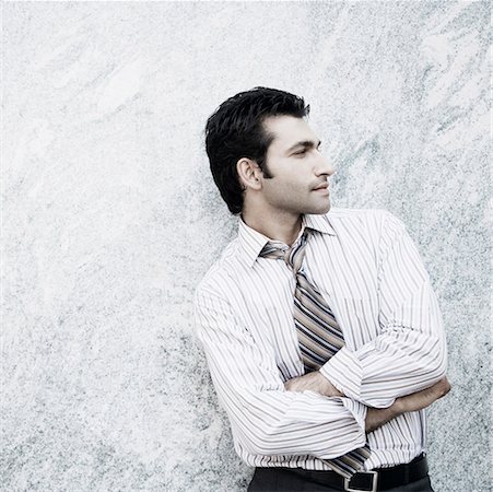 simsearch:630-02219583,k - Close-up of a businessman standing with his arms crossed Stock Photo - Premium Royalty-Free, Code: 630-01874503