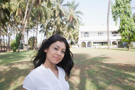 Portrait of a young woman smiling Stock Photo - Premium Royalty-Free, Code: 630-01874907