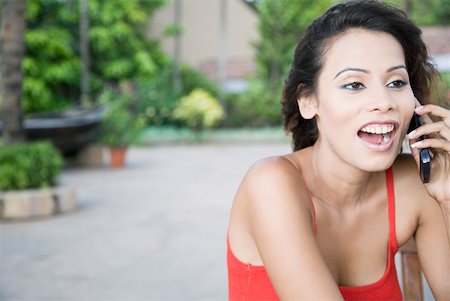 simsearch:630-01709612,k - Close-up of a young woman talking on a mobile phone Stock Photo - Premium Royalty-Free, Code: 630-01875058