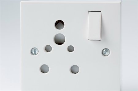 power switch - Close-up of a power socket with a switch Stock Photo - Premium Royalty-Free, Code: 630-01875625