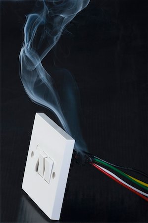 dangerous electrical pictures - Smoke coming out from a switchboard Stock Photo - Premium Royalty-Free, Code: 630-01875631