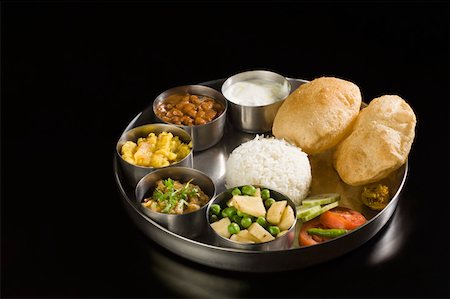 Close-up of assorted Indian food Foto de stock - Sin royalties Premium, Código: 630-01875679