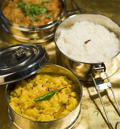 south indian food - Close-up of tiffin boxes of rice and curry Stock Photo - Premium Royalty-Free, Code: 630-01875672