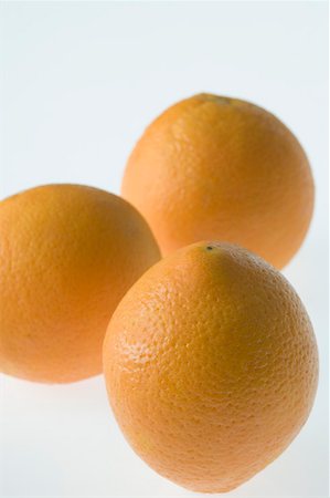 Close-up of three oranges Stock Photo - Premium Royalty-Free, Code: 630-01875703