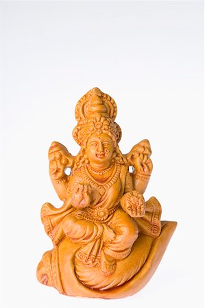 diosa - Close-up of a statue of Goddess Lakshmi Foto de stock - Sin royalties Premium, Código: 630-01875725