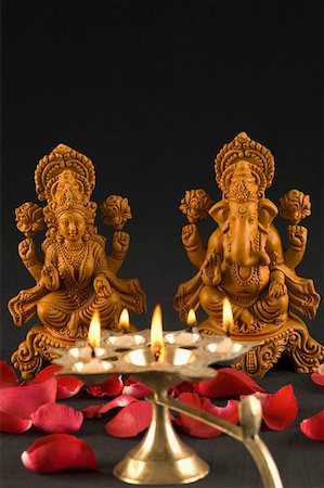 picture of god and goddess - Close-up of an oil lamp burning in front of religious idols Stock Photo - Premium Royalty-Free, Code: 630-01875730