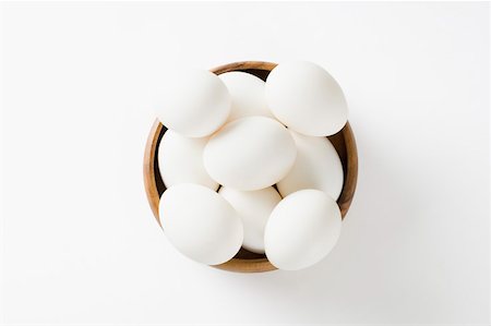 fresh angle photography - Close-up of eggs in a wooden bowl Stock Photo - Premium Royalty-Free, Code: 630-01875745