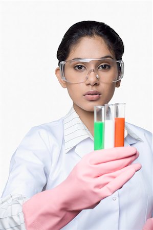 Portrait of a female lab technician holding test tubes Stock Photo - Premium Royalty-Free, Code: 630-01875867