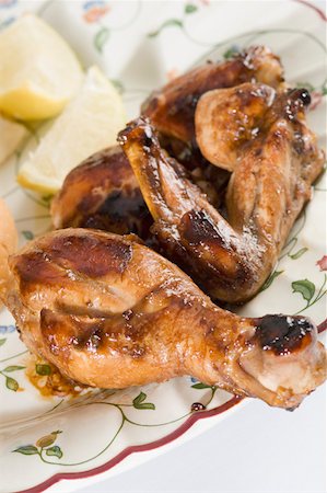 fast food plates - Close-up of roasted chicken in a plate Stock Photo - Premium Royalty-Free, Code: 630-01875996