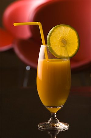 simsearch:630-01875824,k - Close-up of a glass of orange juice with a lemon slice Foto de stock - Sin royalties Premium, Código: 630-01876014