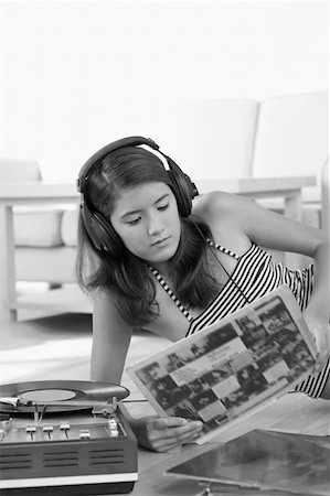 record player - Young woman wearing headphones and listening to music Stock Photo - Premium Royalty-Free, Code: 630-01876152