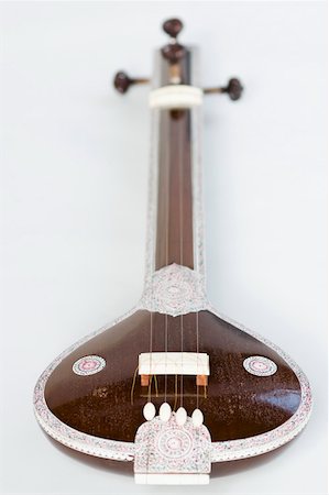 simsearch:630-01876125,k - Close-up of a sitar Fotografie stock - Premium Royalty-Free, Codice: 630-01876212