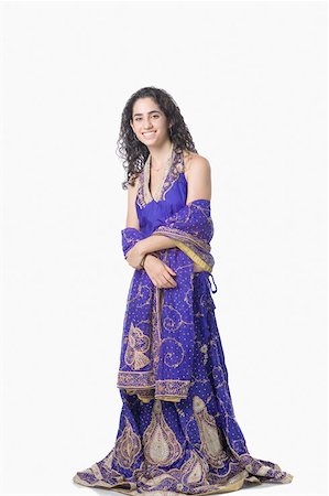 simsearch:630-01876237,k - Portrait of a young woman posing in traditional clothing and smiling Stock Photo - Premium Royalty-Free, Code: 630-01876246