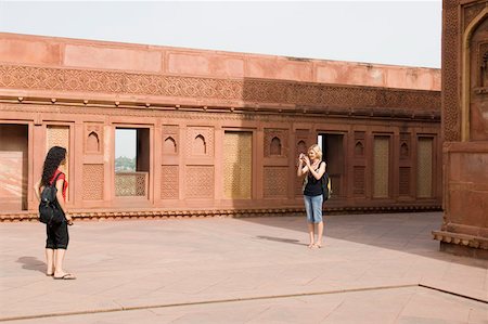 simsearch:630-01128539,k - Young woman taking a picture of her friend, Taj Mahal, Agra, Uttar Pradesh, India Stock Photo - Premium Royalty-Free, Code: 630-01876327