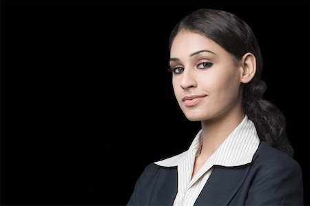 profile portrait black background - Portrait of a businesswoman smirking Stock Photo - Premium Royalty-Free, Code: 630-01876482