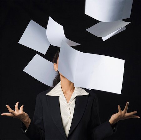 papers and backgrounds - Businesswoman throwing papers in air Stock Photo - Premium Royalty-Free, Code: 630-01876492