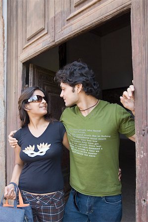 simsearch:6107-06117899,k - Young couple looking at each other at a doorway, Goa, India Stock Photo - Premium Royalty-Free, Code: 630-01876669