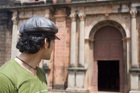 simsearch:630-01876662,k - Close-up of a young man standing in front of a building, Goa, India Stock Photo - Premium Royalty-Free, Code: 630-01876662