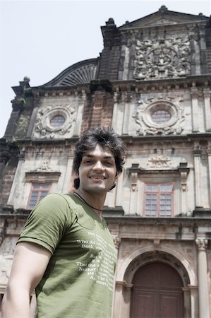 simsearch:630-01876662,k - Portrait of a young man smiling in front of a building, Goa, India Stock Photo - Premium Royalty-Free, Code: 630-01876663