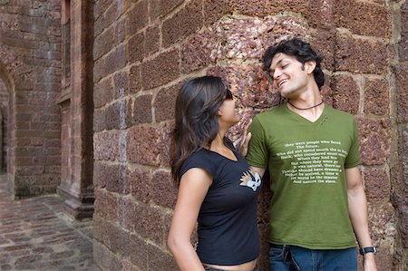 simsearch:6107-06117899,k - Young couple looking at each other and smiling, Goa, India Stock Photo - Premium Royalty-Free, Code: 630-01876674