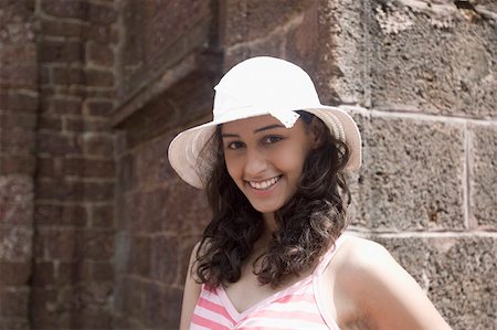 Portrait of a young woman smiling Goa, India Stock Photo - Premium Royalty-Free, Code: 630-01876677
