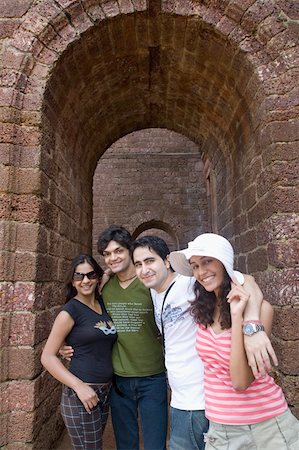 Portrait of two young couples standing together and smiling, Goa, India Stock Photo - Premium Royalty-Free, Code: 630-01876682
