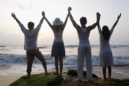 Rear view of two young couples standing together Stock Photo - Premium Royalty-Free, Code: 630-01876748