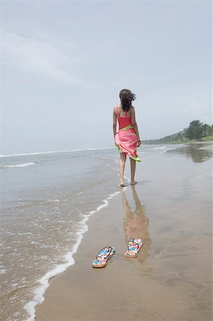 so long - Rear view of a woman walking on the beach Stock Photo - Premium Royalty-Free, Code: 630-01876797