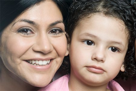 Close-up of a mid adult woman smiling with her son Foto de stock - Sin royalties Premium, Código: 630-01877536