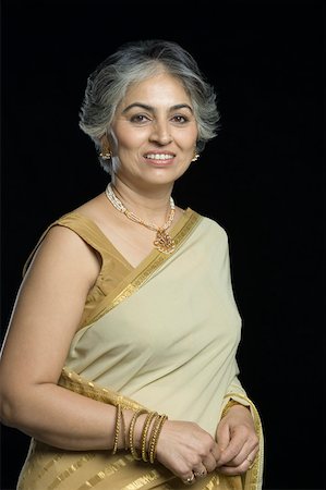 Portrait of a mature woman smiling Fotografie stock - Premium Royalty-Free, Codice: 630-01877589