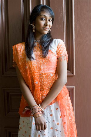 smile desi girl images - Portrait of a teenage girl smiling Stock Photo - Premium Royalty-Free, Code: 630-01877694