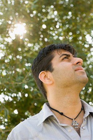 desi guy - Close-up of a mid adult man looking curious Stock Photo - Premium Royalty-Free, Code: 630-01877724